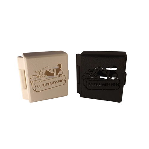 Two rectangular objects, one beige and one black, with 'scrummission' branding on a white background.